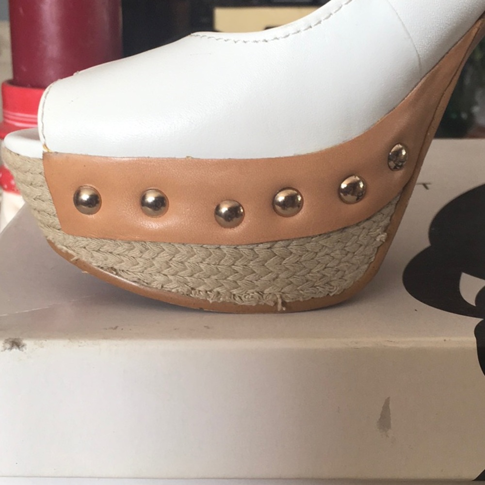 White leather platform heels.